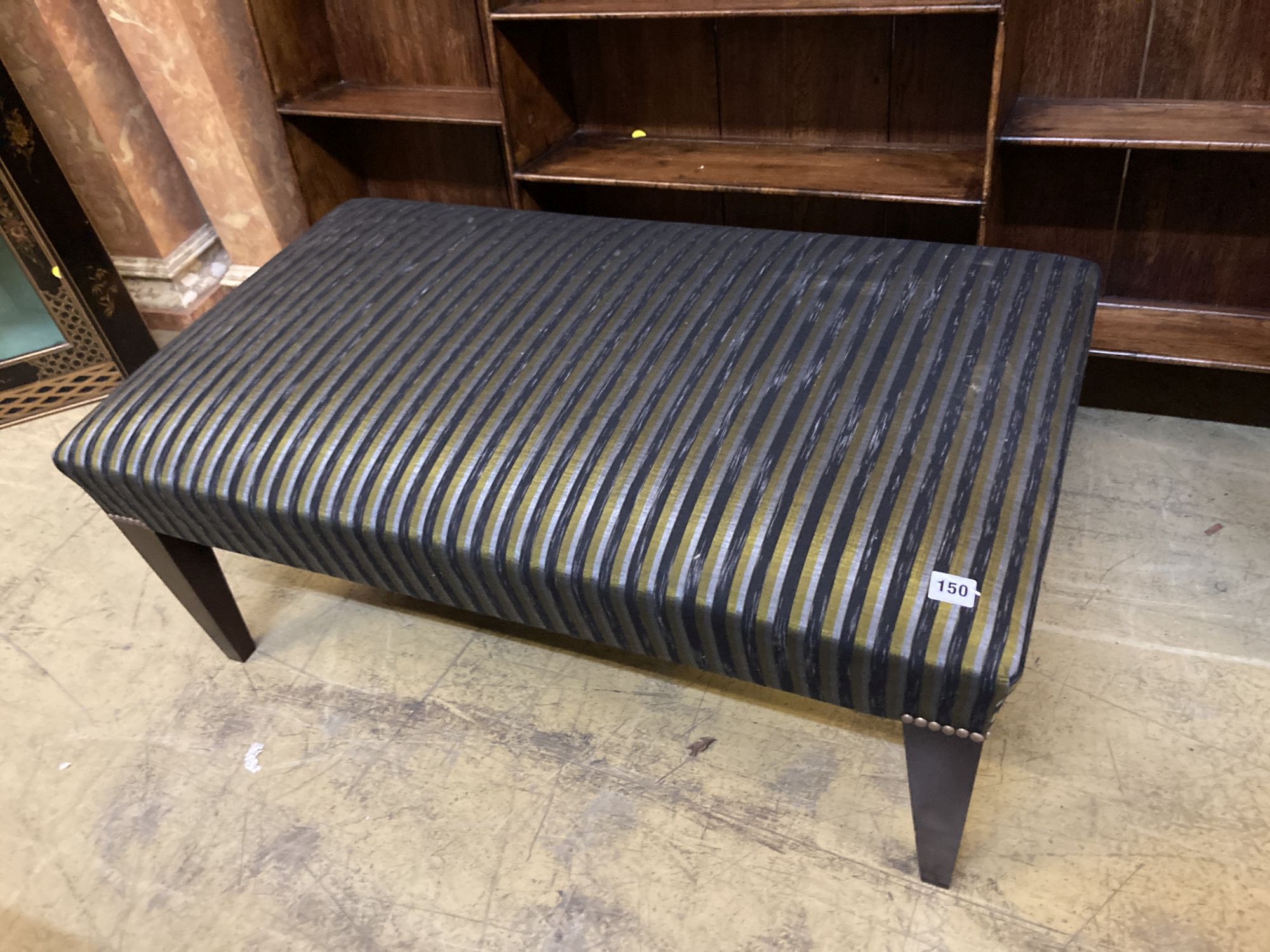 A modern rectangular footstool on square tapered legs, width 100cm, depth 56cm, height 38cm